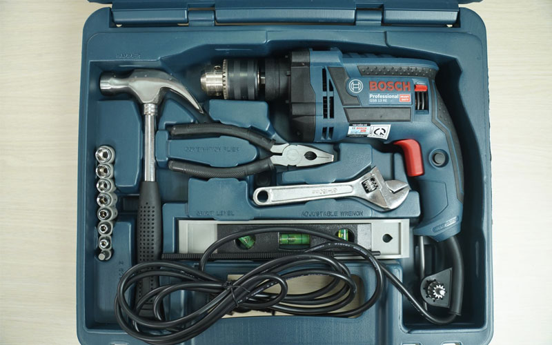 Máy khoan động lực Bosch GSB 13RE (bộ set có valy 100 món phụ kiện)